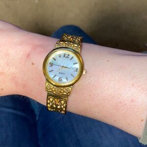 Women's Gold Tone Bangle Bracelet Watch with Intricate Detail, MOP Face